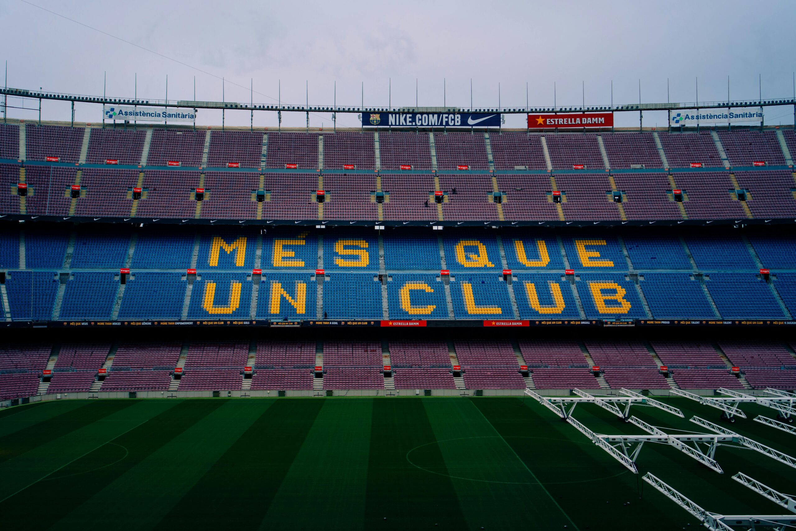 View of Camp Nou stadium seating displaying 'Mes Que Un Club' in Barcelona, Spain.