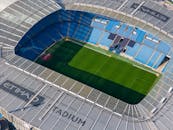 Stunning aerial shot capturing the modern architecture of Etihad Stadium in Manchester.