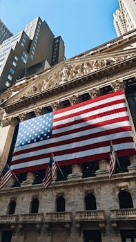 American flag adorning the iconic New York Stock Exchange building facade.