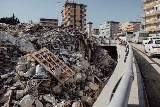 A city scene showing extensive earthquake damage with debris and ruins.